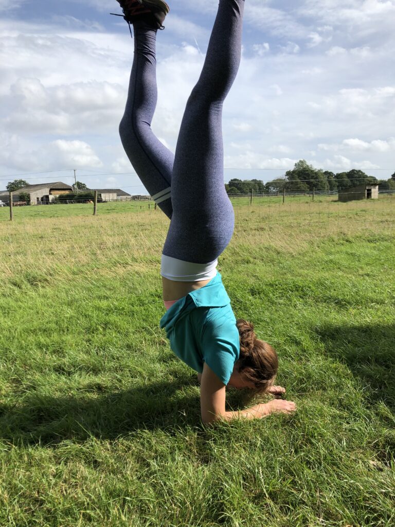 Holiday workout ideas. Here is Caroline doing an impromptu forearm stand at a camp site.